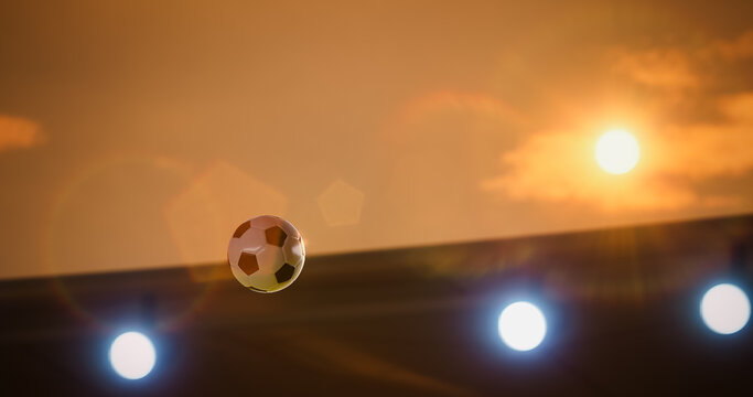 Football Championship Ball Flies Through the Air Above the Stadium in a Decisive Goal Moment, Lit by Sunset, Floodlights, and Lens Flare, Capturing Victory, Win, Speed, and Intense Match Action.