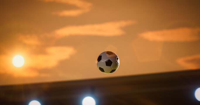 Football Championship Ball Flies Through the Air Above the Stadium in a Decisive Goal Moment, Glowing Against a Golden Sunset Sky and Floodlights, Capturing Victory, Win, Speed, and Match Drama.