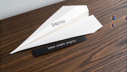 Naklejka premium White paper airplane with inspirational quotes on wood