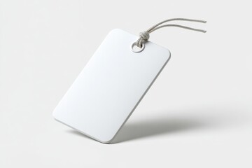Fototapeta premium Isolated plastic luggage tag with string loop, placeholder for branding