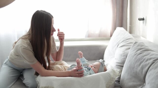 Tender moments between a mother and her baby during playtime