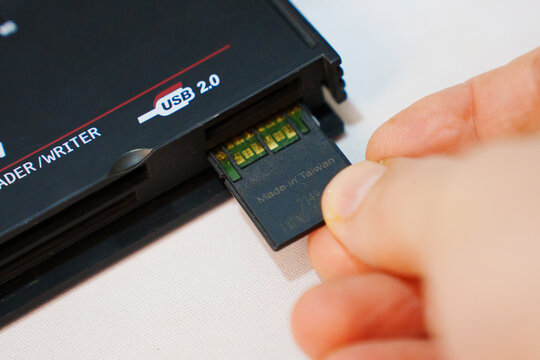 2026.04.26, Russia. Inserting memory card into USB reader
