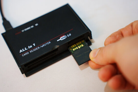 2026.04.26, Russia. Inserting memory card into USB reader