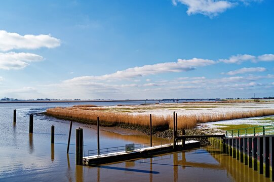 Empty dock on the river Ems in winter, East Frisia, Lower Saxony, Germany