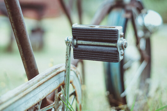 Close-up of a bicycle pedal on an old bicycle parked in a rural landscape, Sweden