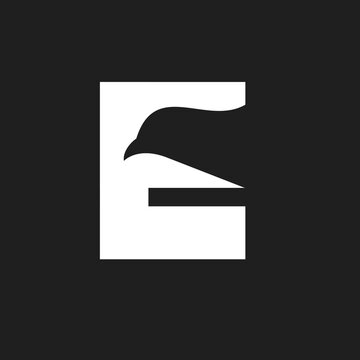 Letter E Eagle Logo Design with Minimalist Bird Head Silhouette
