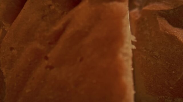 Detailed macro view of white bread crumb showing porous airy texture and crispy crust. Concept of homemade food, bakery products, bakeries and bread factories, market, gastronomy and culinary art