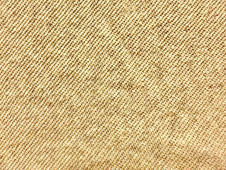 Fototapeta premium closeup beige burlap fabric texture with diagonal weave evoking rustic warmth and natural elegance in minimalist composition