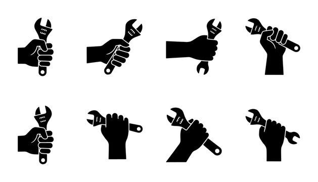 Industrial wrench icon set, human hand holding adjustable spanner vector, 8 black silhouette mechanic tool symbols for repair and maintenance