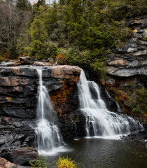 Fototapeta premium Blackwater Falls in West Virginia with Long Exposure Water Flow in Autumn Forest