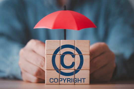Copyright protection concept with symbol under umbrella represent intellectual property rights, legal security, digital content protection, ownership, licensing and risk management in modern business