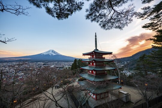 Five-story pagoda of a Shinto Shrine, Chureito Pagoda, with views of Fujiyoshida City and Mount Fuji volcano at sunset, Arakura Fuji Sengen Shrine, Arakurayama Sengen Park, Yamanashi Prefecture, Japan