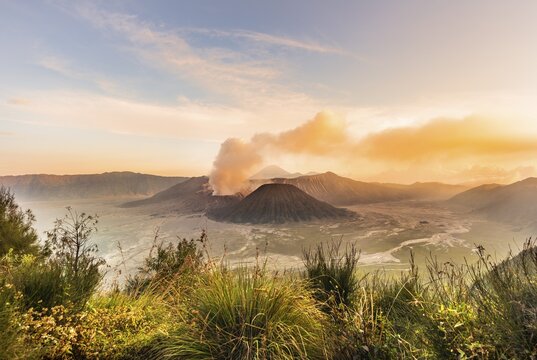 Sunrise, smoking volcano, Gunung Bromo, Mount Batok, Mount Kursi, Mount Semeru, Bromo Tengger Semeru National Park, Java, Indonesia