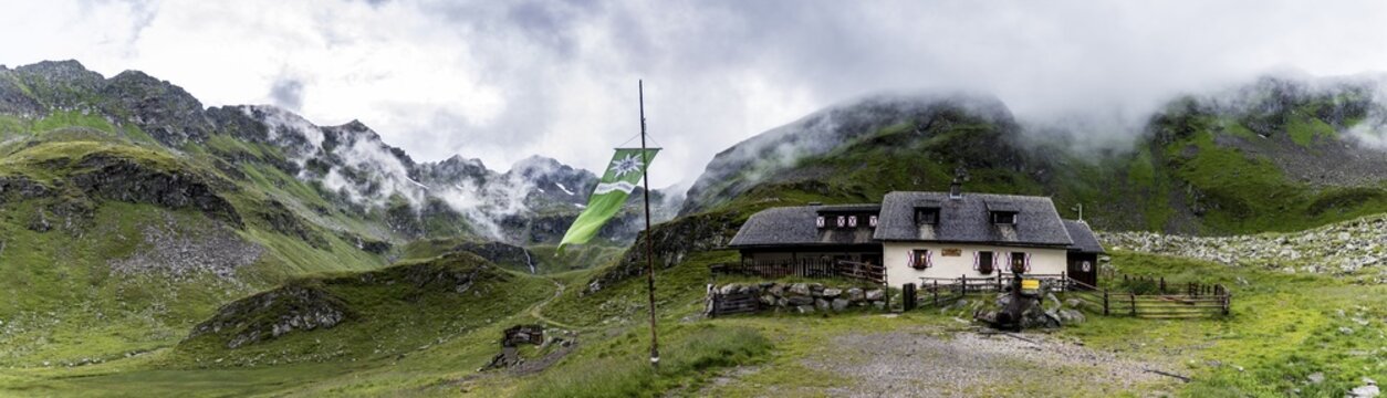 Landawirseeh&uuml;tte and Alpine Club flag with cloudy Alpine valley, Rohrmoos-Untertal, Schladming, Schladming Tauern, Styria, Austria