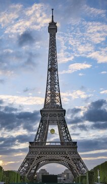 Sunset behind the Eiffel Tower, Champ de Mars, Paris, Ile-de-France, France