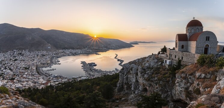 Sunrise, greek-orthodox monastery Saint Savvas, town view of Kalymnos, harbour and sea, Kalymnos, Dodecanese, Greece