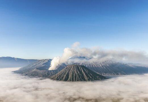 Mount Bromo smoking volcano, Mount Batok, Mount Kursi, Mount Gunung Semeru, Bromo Tengger Semeru National Park, East Java, Indonesia