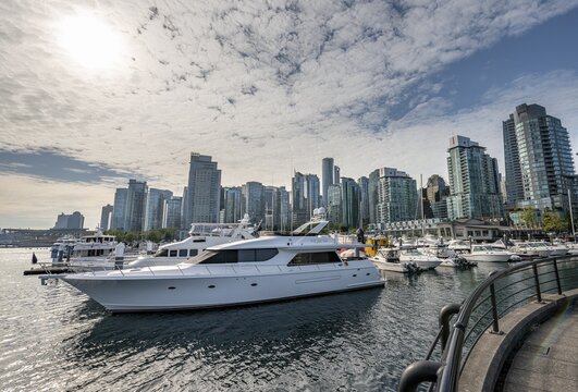 Boats in the marina, high-rise buildings on the promenade, Coal Harbour, Vancouver, British Columbia, Canada