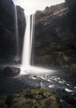 Waterfall Kvernufoss in a gorge, dramatic dark atmosphere, time exposure, near Sk&oacute;gafoss, Southurland, Iceland