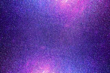 Black dark indigo blue gold orange glitter shiny abstract background for design. Twinkling glow stars effect. Fantastic, fantasy. Like outer space, night sky, universe. Grain, rough surface. © Sumeth