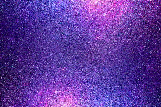 Black dark indigo blue gold orange glitter shiny abstract background for design. Twinkling glow stars effect. Fantastic, fantasy. Like outer space, night sky, universe. Grain, rough surface.