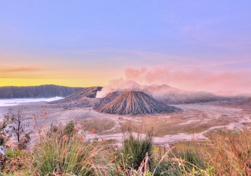 Sunrise, smoking Mount Bromo, Mt. Batok at front, Mt. Kursi at back, Mt. Gunung Semeru, Bromo Tengger Semeru National Park, Java, Indonesia