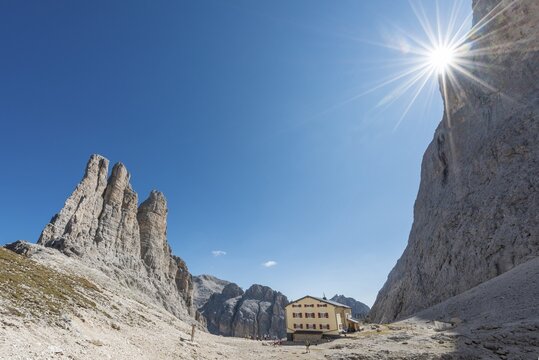 Descent from the Santner via ferrata, in front of Gartl hut, at the back climbing cliffs with Vajolett towers, Rosengarten group, Dolomites, UNESCO World Heritage Site, Alps, South Tyrol, Trentino-Alto Adige, Italy