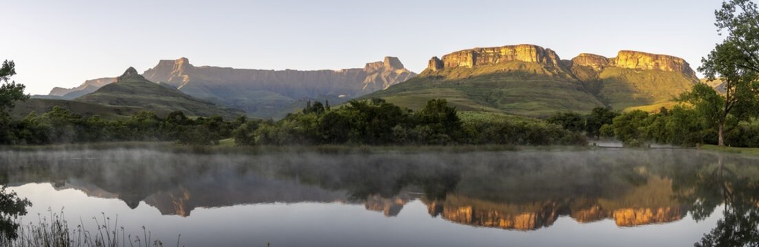 Sunrise, amphitheatre with reflection in the lake, Royal Natal National Park, Drakensberg Mountains south, Kwa Zulu Natal, South Africa
