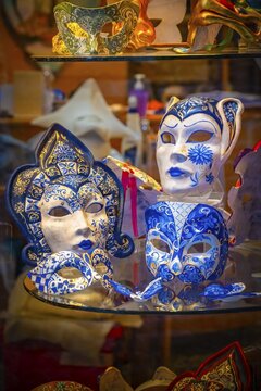 Venetian carnival masks in a shop window, Venice, Veneto, Italy