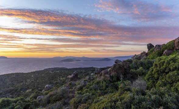Sunset over the sea, landscape with macchia, in the back islands Gyali and Kos, Nisyros, Dodecanese, Greece