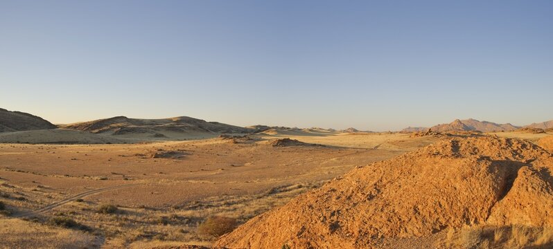 Desert landscape in evening light near Rock Arch in Namib-Naukluft National Park, Namibia, Africa