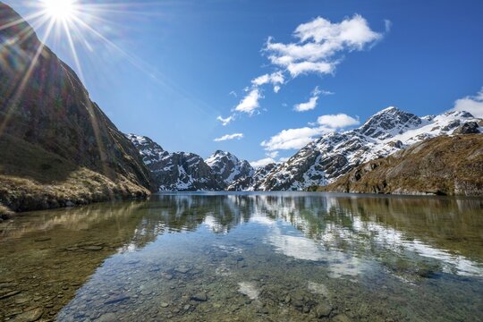 Mountains reflected in lake, Lake Harris, Conical Hill, Routeburn Track, Mount Aspiring National Park, Westland District, West Coast, South Island, New Zealand