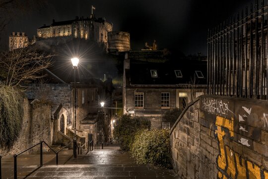 Illuminated castle at night, Edinburgh Castle from The Vennel Viewpoint, historic old town, Edinburgh, Scotland, United Kingdom