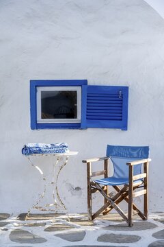 Cycladic house, Blue window and blue chair, Paros, Cyclades, Greece
