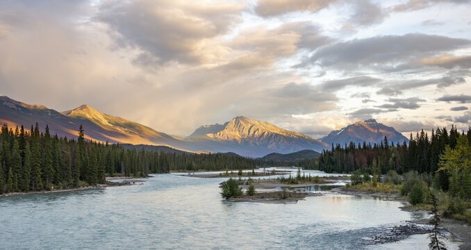 View of a valley with river, mountains in the evening light, Mount Hardisty and Mount Kerkeslin, sunset, Icefields Parkway, Athabasca River, Jasper National Park, Alberta, Canada
