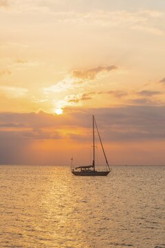 Sunrise, sailboat in the sea, Lovina Beach, Bali, Indonesia