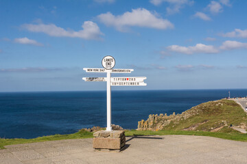 The Iconic Land's End Signpost with Distance Markers Overlooking the Atlantic Ocean  © Stephan