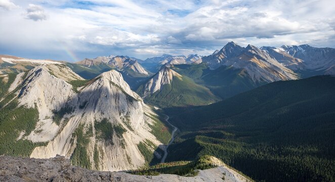 Mountain landscape with river valley and peaks, rainbow, peaks with orange sulphur deposits, Overturn Mountain, panoramic view, Nikassin Range, near Miette Hotsprings, Sulphur Skyline, Jasper National Park, Alberta, Canada