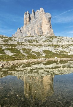 Cime Grande is reflected in a lake, hiking trail around the Three Peaks of Lavaredo, Sexten Dolomites, South Tyrol, Trentino-South Tyrol, Alto-Adige, Italy