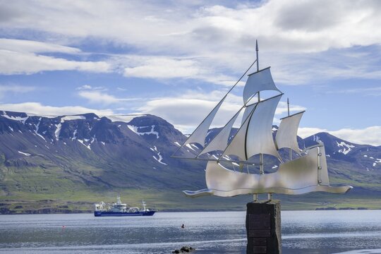 Trawler and emigrants' monument in the harbour of, Vopnafj&ouml;r&eth;ur, Austurland, Iceland