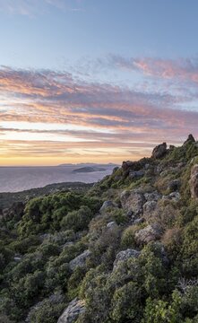Sunset over the sea, landscape with macchia, in the back islands Gyali and Kos, Nisyros, Dodecanese, Greece