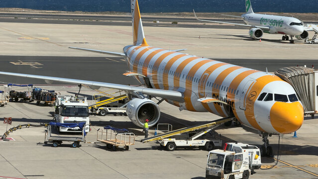 April 9th, 2026, Fuertaventura, Spain. Commercial aircraft with colorful striped design parked on apron aviation travel scene