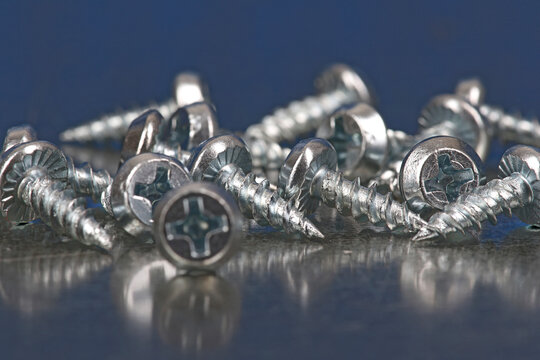 Metal mounting screws close-up. Macro image.