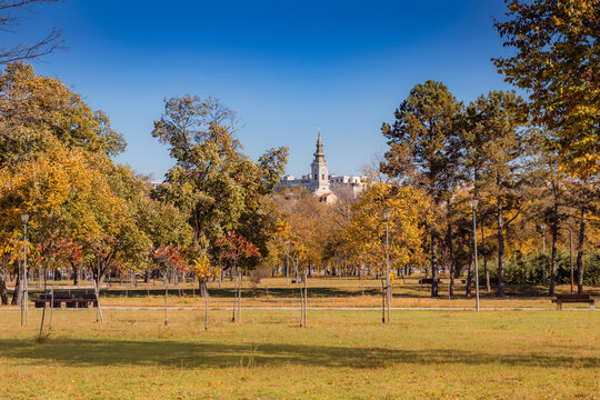Colorful autumn trees filling Usce park with the Church spire in the background, Belgrade