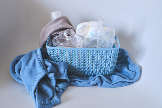 Basket with essential baby products like diapers and skincare items