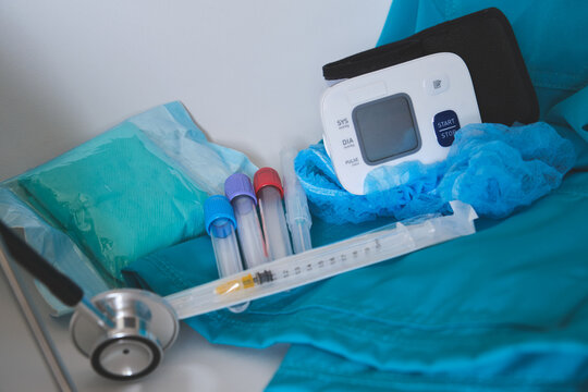 Healthcare accessories including a blood pressure monitor, test tubes, and stethoscope