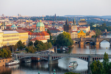 Obraz premium View of the Vltava River and the bridges shined with the sunset sun, Prague, the Czech Republic