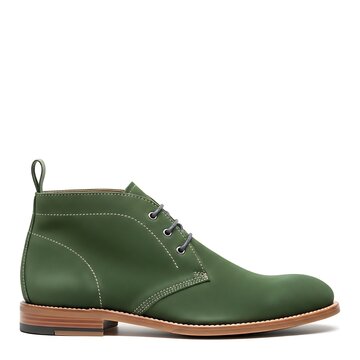 High-quality green leather footwear featuring a sleek ankle-height design and contrasting stitch details isolated on a white surface.