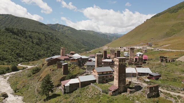 Aerial view Murkmeli village panorama. Svan towers settlement in Ushguli. Accommodation in Svaneti concept. Popular sightseeing attraction landmark in summer Georgia