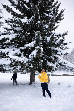 Portrait Beautiful asian fat woman smile happy travel and enjoy with snow winter season. Wearing thick coat, Snowy landscape surrounds, Joyful winter moment, perfect for family scenes. Vacation